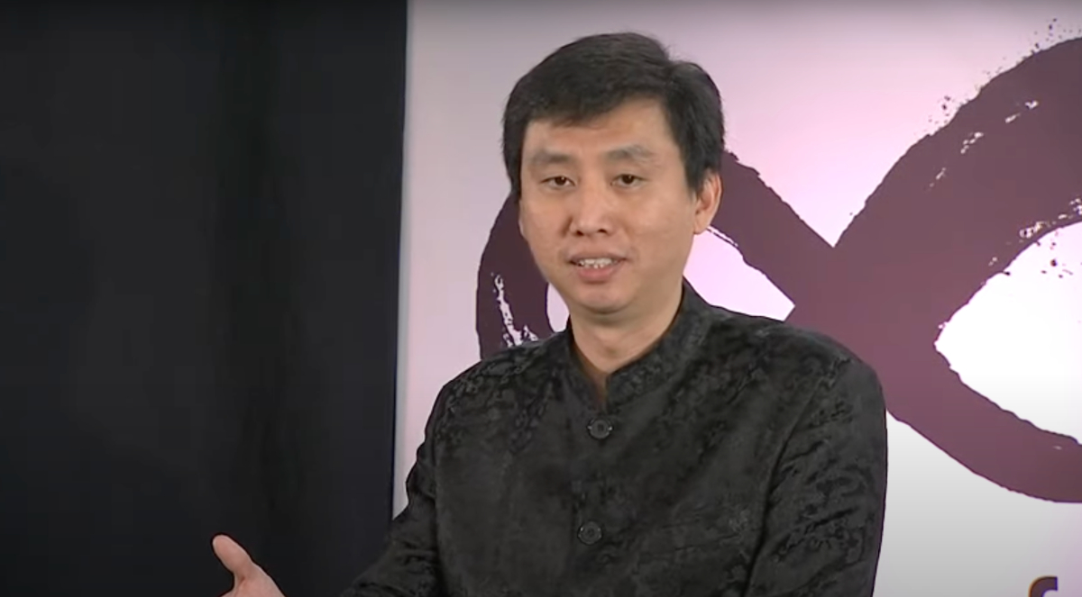 Chade-Meng Tan, wearing a black button-up shirt, delivers his TED talk.